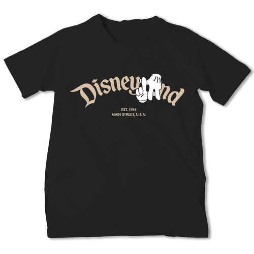 A black short-sleeve t-shirt with a vintage-style graphic on the chest reading 'Disneyland' in beige script, featuring a white mouse silhouette and the text 'EST. 1954' and 'MAIN STREET U.S.A.