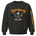 A black crewneck sweatshirt featuring a Halloween-themed Disneyworld graphic on the front with a skeleton Mickey Mouse, skulls, bats, and orange dripping text. The left sleeve features vertical orange text reading 'Walt Disney World'.