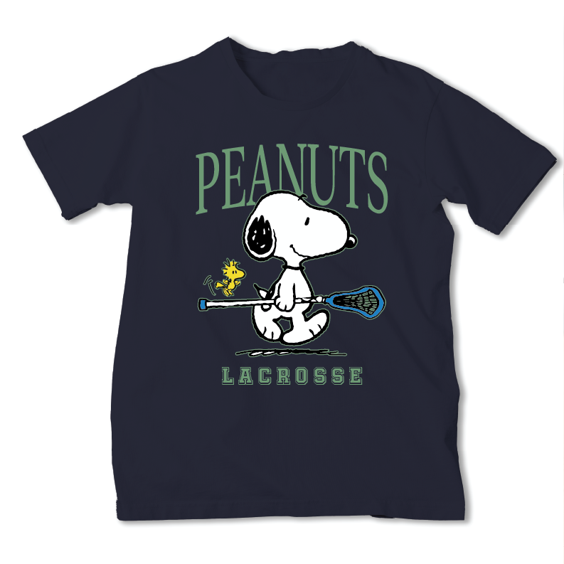 A navy blue short-sleeve t-shirt featuring a graphic of Snoopy holding a lacrosse stick with Woodstock beside him, under the word 'PEANUTS' and above 'LACROSSE'.