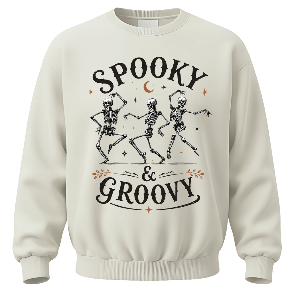 Spooky & Groovy skeleton Halloween shirt featuring dancing skeletons, stars and a crescent moon. A fun retro tee for spooky season.